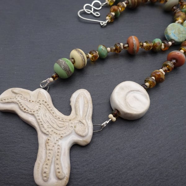 ceramic hare and lampwork glass necklace