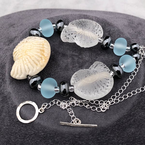 ammonite fossil nautilus shell shaped seaglass style lampwork glass necklace