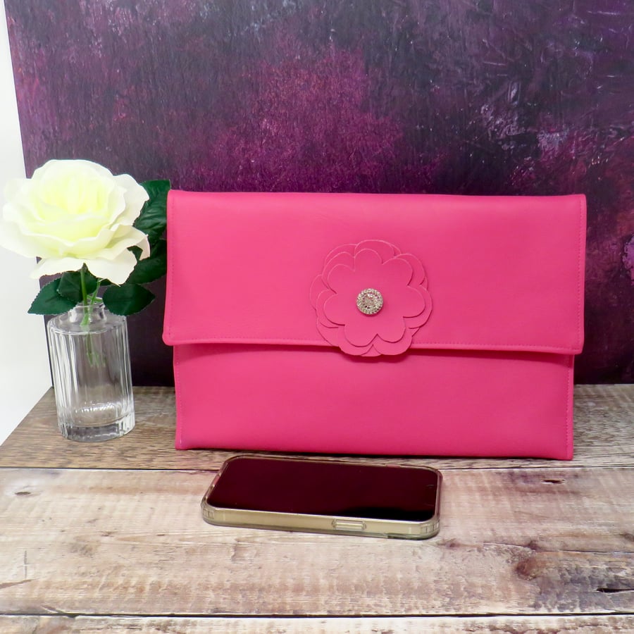 Pink faux leather clutch bag
