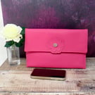 Pink faux leather clutch bag