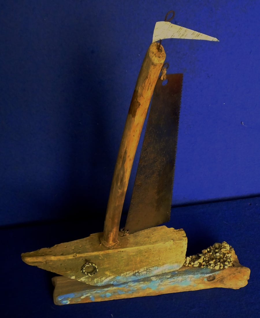 Cornish driftwood sailing ship yacht with hand saw blade as a sail for display
