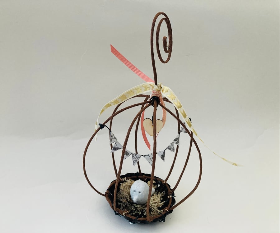 Wire bird cage sculpture