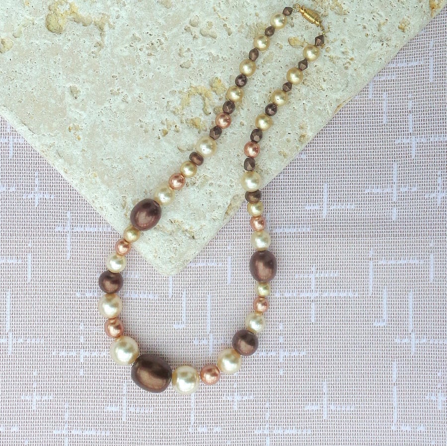 Necklace of glass pearl beads in shades of coffee and cream