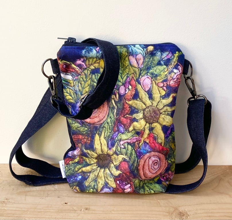 Flower cross body shoulder bag with long strap. 