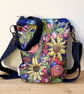 Flower cross body shoulder bag with long strap. 