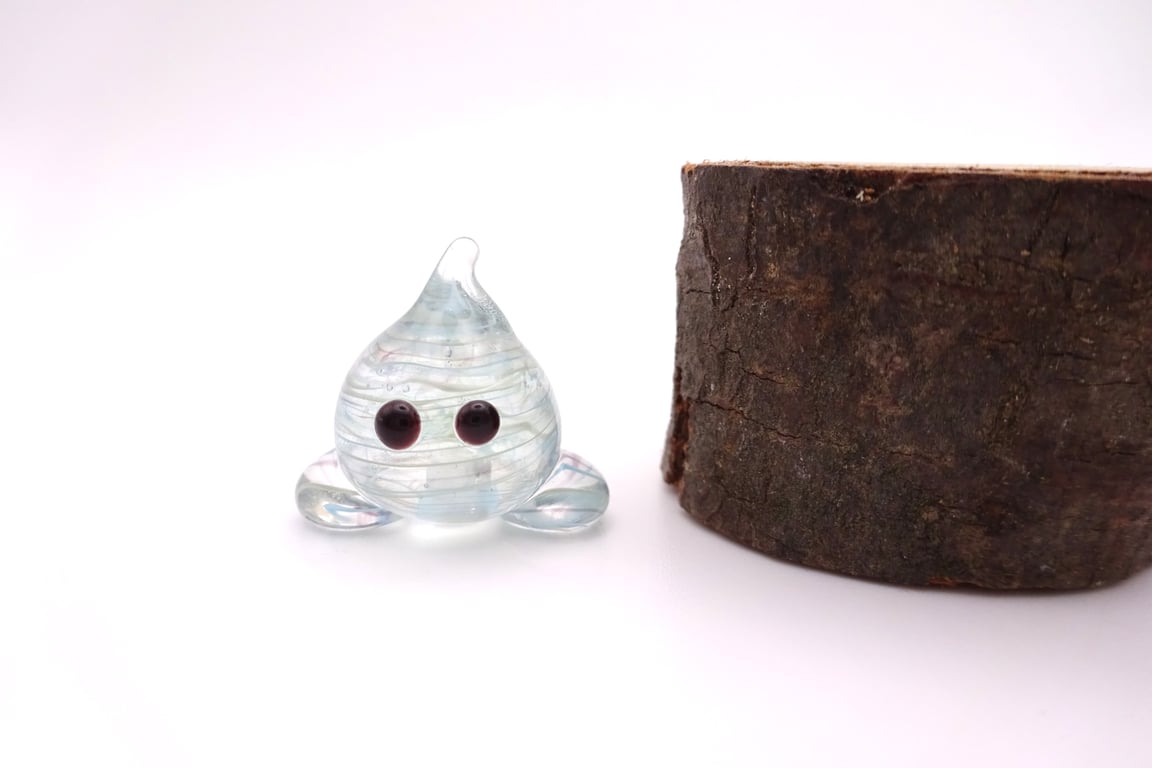small blue wispy glass wisp figure