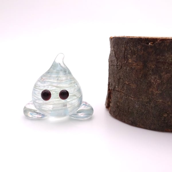 small blue wispy glass wisp figure