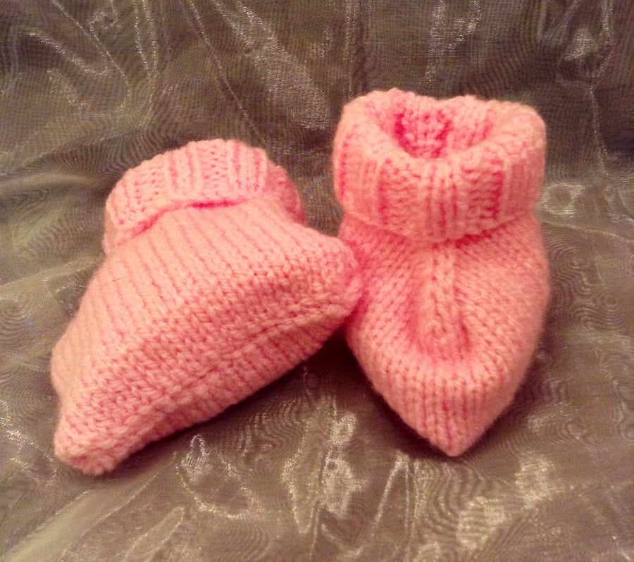 Pink knitted baby booties