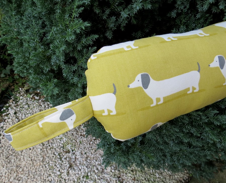 Long dog.  A draught excluder, 107cm in length.  