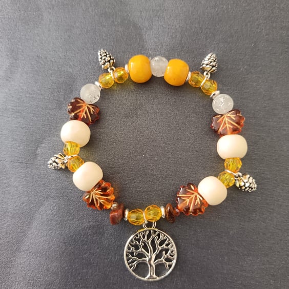 Silver tree of life and pine cone charm elasticated bracelet with autumnal beads