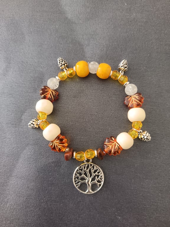 Silver tree of life and pine cone charm elasticated bracelet with autumnal beads