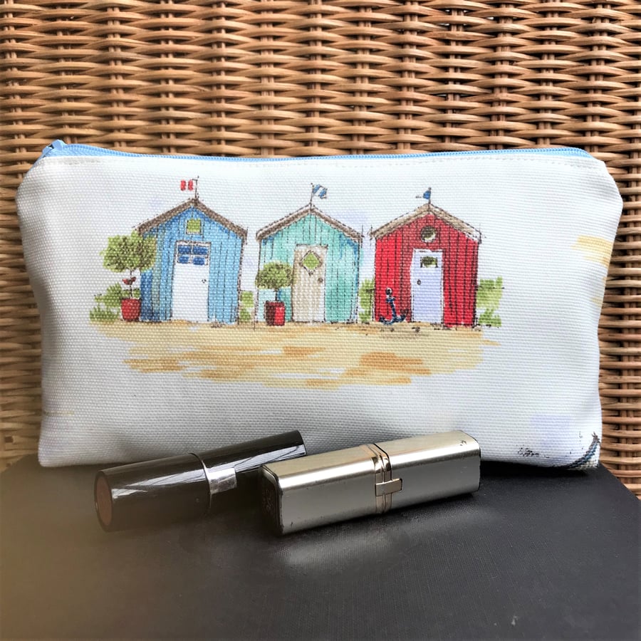 Cosmetic bag, make up bag in ceam with three beach huts
