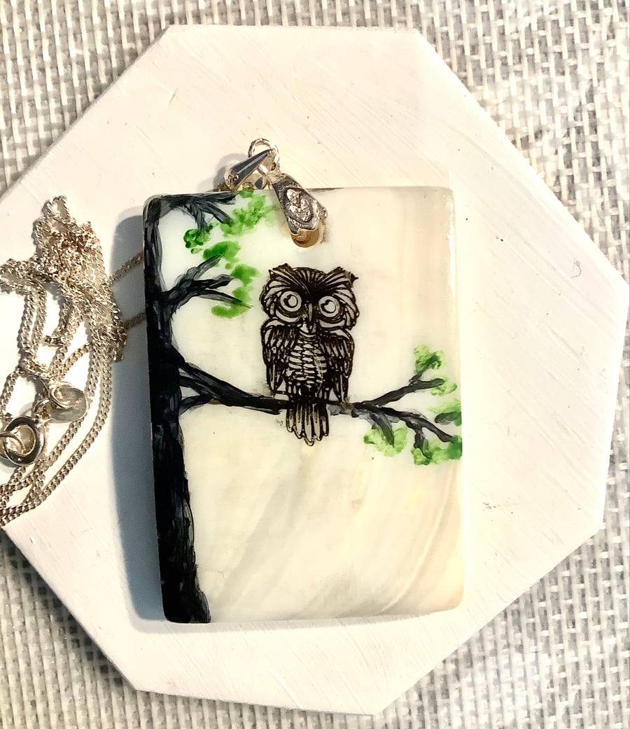 Shell pendent with a owl stamp and acrylic painted accents