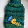 Snuggly hand knitted hot water bottle cover