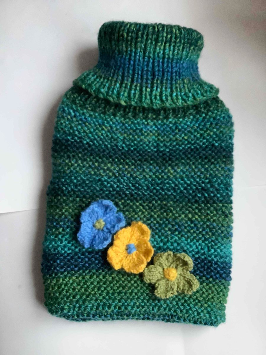 Snuggly hand knitted hot water bottle cover