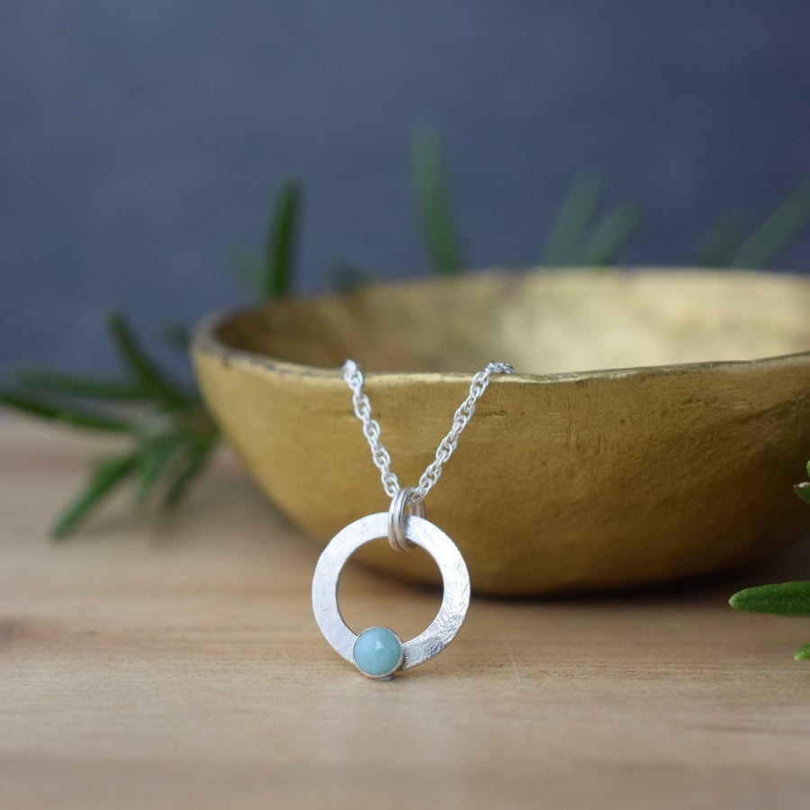 Sterling silver circle pendant with larimar gemstone