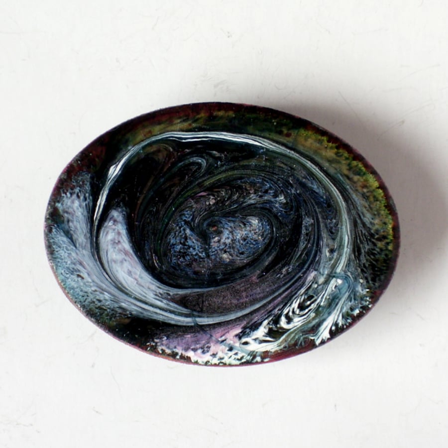 brooch scrolled purple and white over black enamel on clear enamel