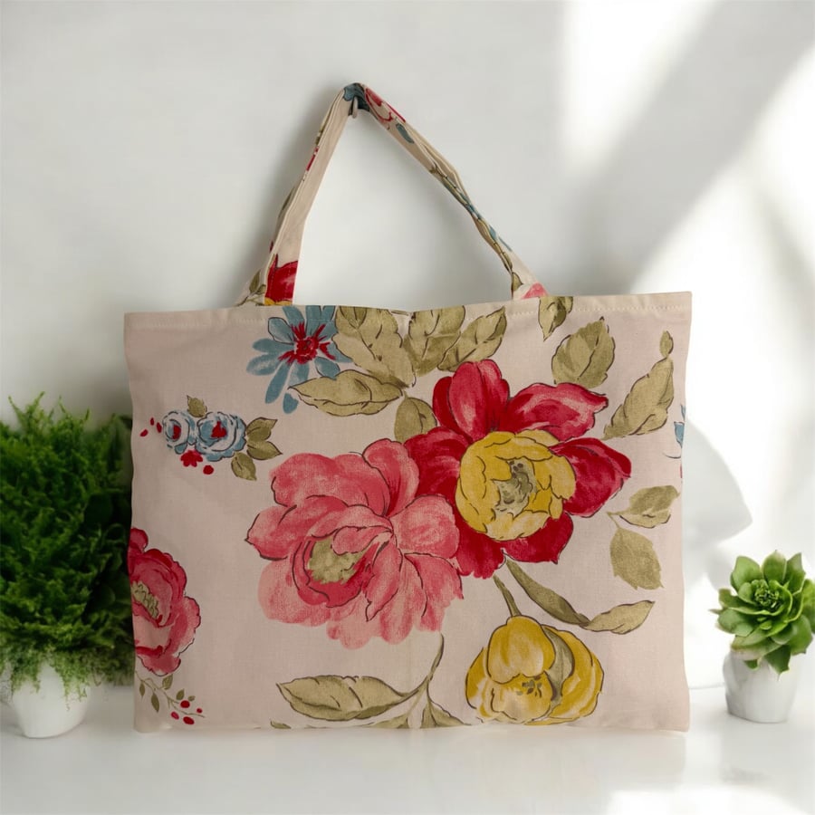Large pink and gold flowers on a calico inspired fabric tote bag 