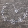 Square spiral silver necklace