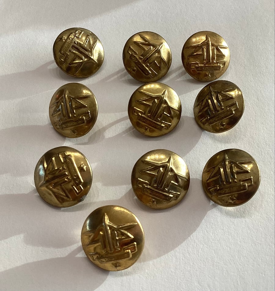 Brass coloured buttons, military style