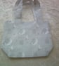 Miffy Rabbit sitting on Crescent Moons on a Pale Grey background Fabric Bag - Image 1