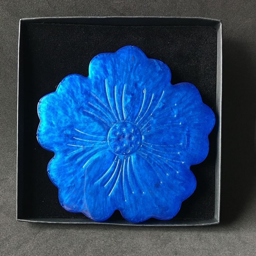 Royal blue flower coaster with heat resistant resin.