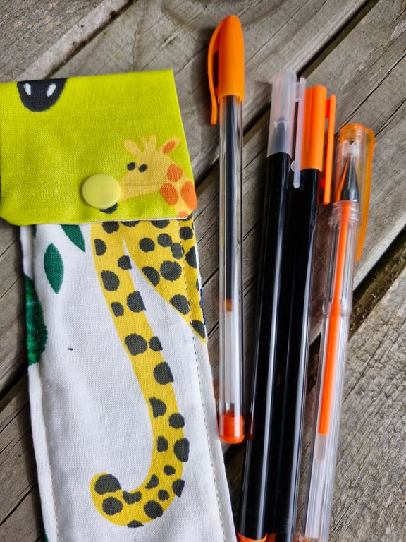 Giraffe and animal print pen case with 4 orange pens ideal stocking filler