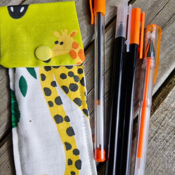 Giraffe and animal print pen case with 4 orange pens ideal stocking filler