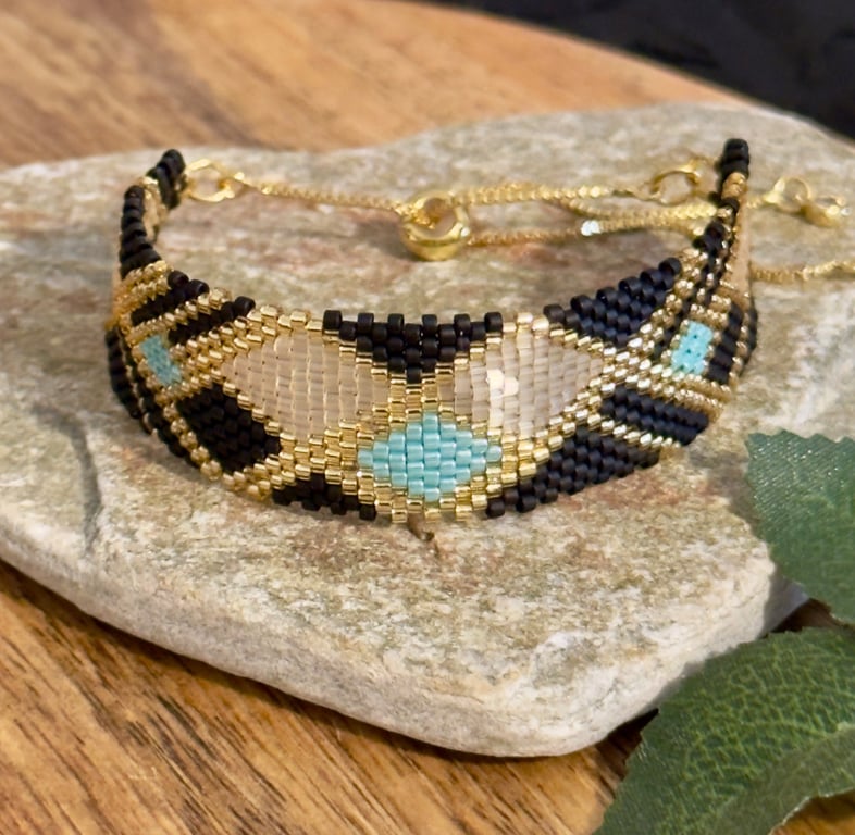 Geometric beadwork peyote bracelet in black and gold with slider chain 
