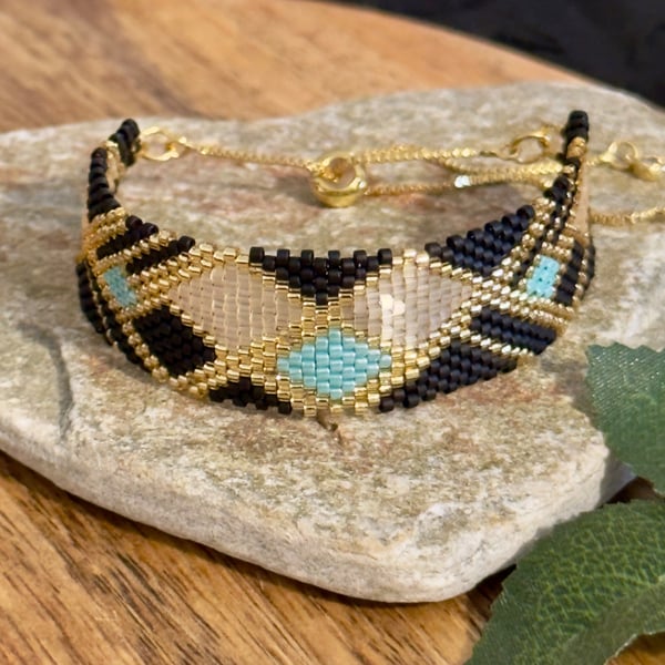Geometric beadwork peyote bracelet in black and gold with slider chain 