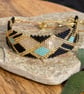 Geometric beadwork peyote bracelet in black and gold with slider chain 
