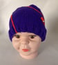 Children's hand knitted pencil and scribble hat