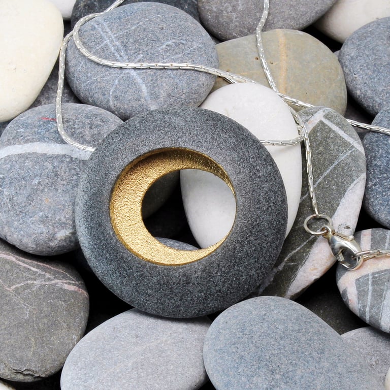 Round pebble pendant with a quality sterling silver chain. Nature inspired