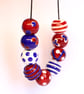 Handmade red, white and blue patterned lampwork glass beads - Image 4