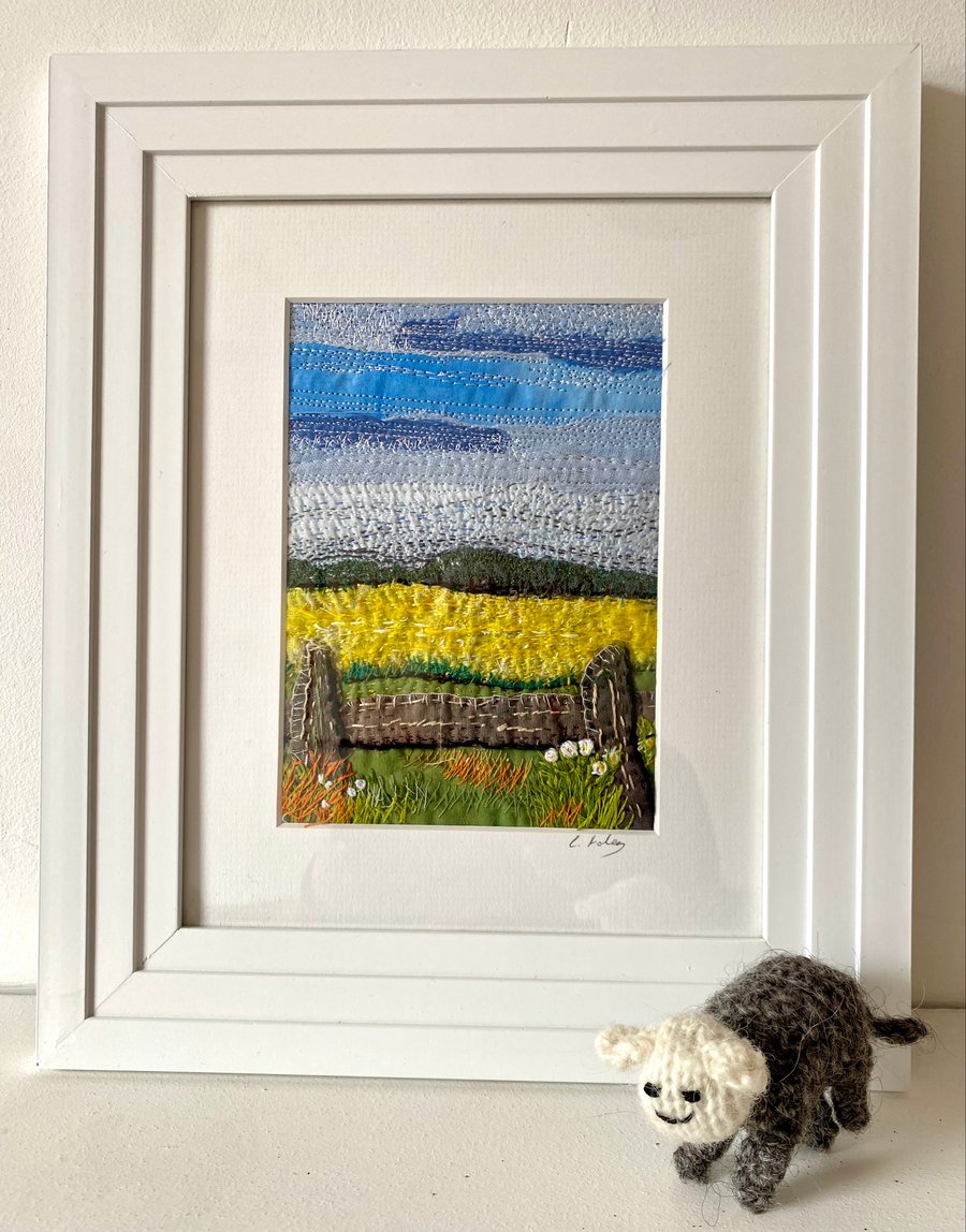 Yellow fields over the fence, embroidered landscape textile collage 