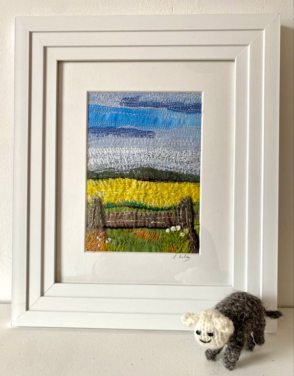 Yellow fields over the fence, embroidered landscape textile collage 