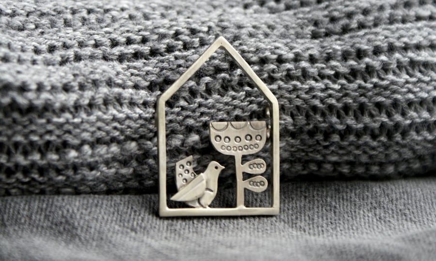 Silver house and bird brooch