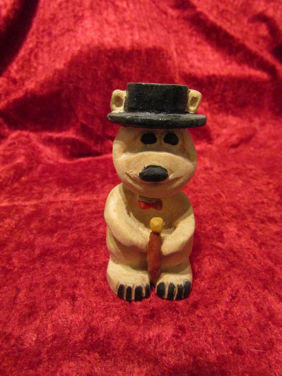 Whittled wood bear with top hat and cane