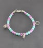 Kids glass beaded shell charm bracelet with sea green and plum beads  - Image 1
