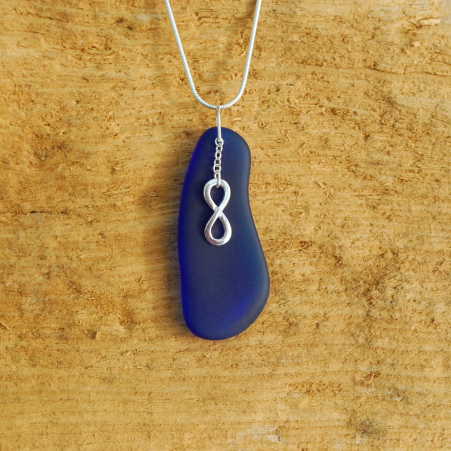 Beach glass pendant with infinity charm