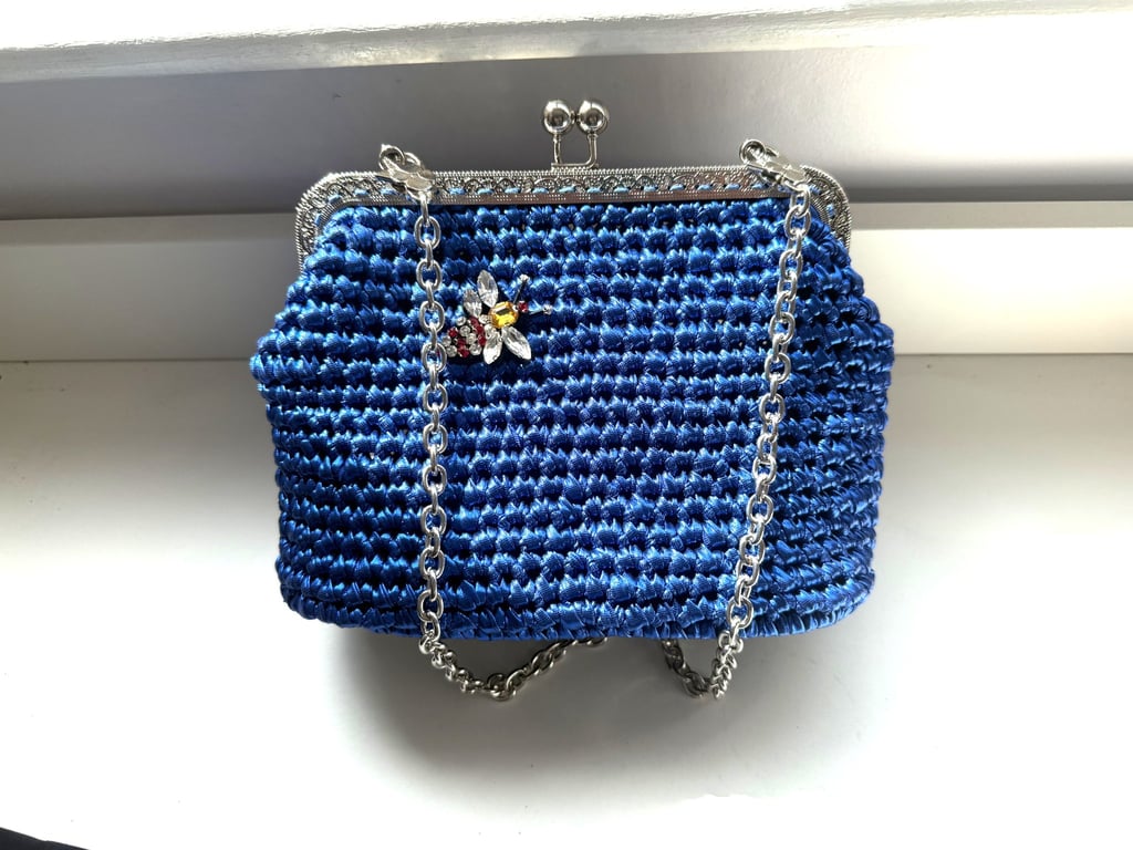Electric blue crocheted handbag with bee decoration