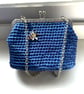 Electric blue crocheted handbag with bee decoration