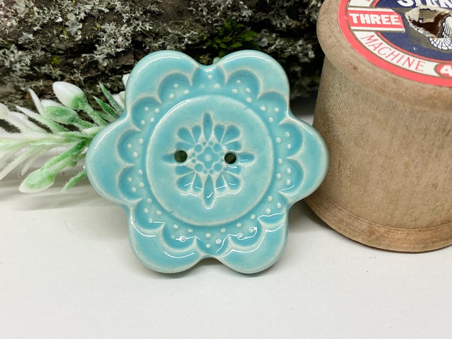 Large ceramic flower shaped button pale blue