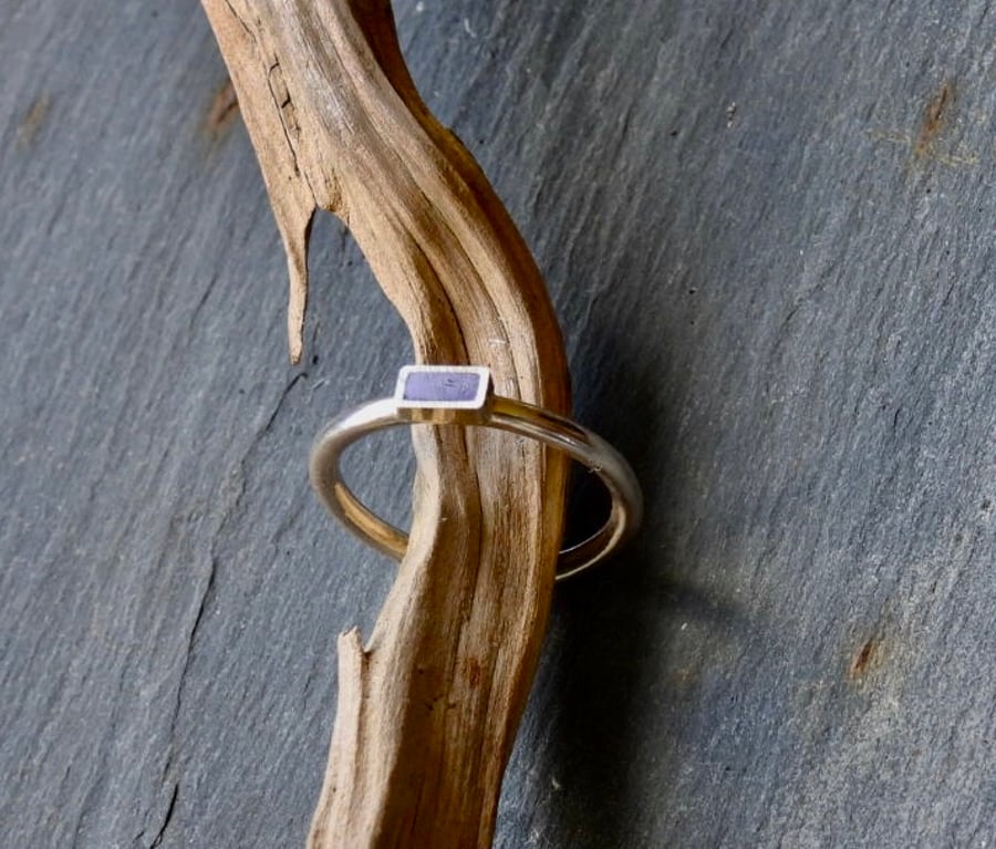Silver Ring With A Rectangular Setting And Purple Insert.
