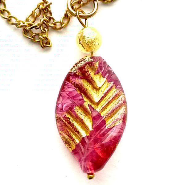 Murano Glass pink and gold Murano Glass leaf pendant with gold chain.