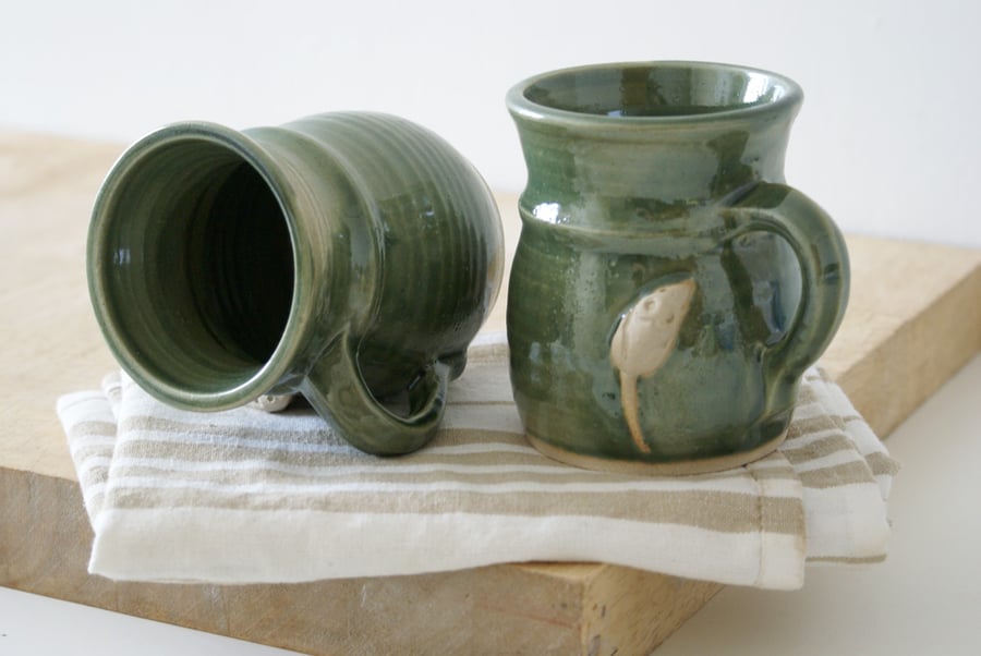 Two stoneware pottery coffee mugs - glazed in forest green with tiny mouse