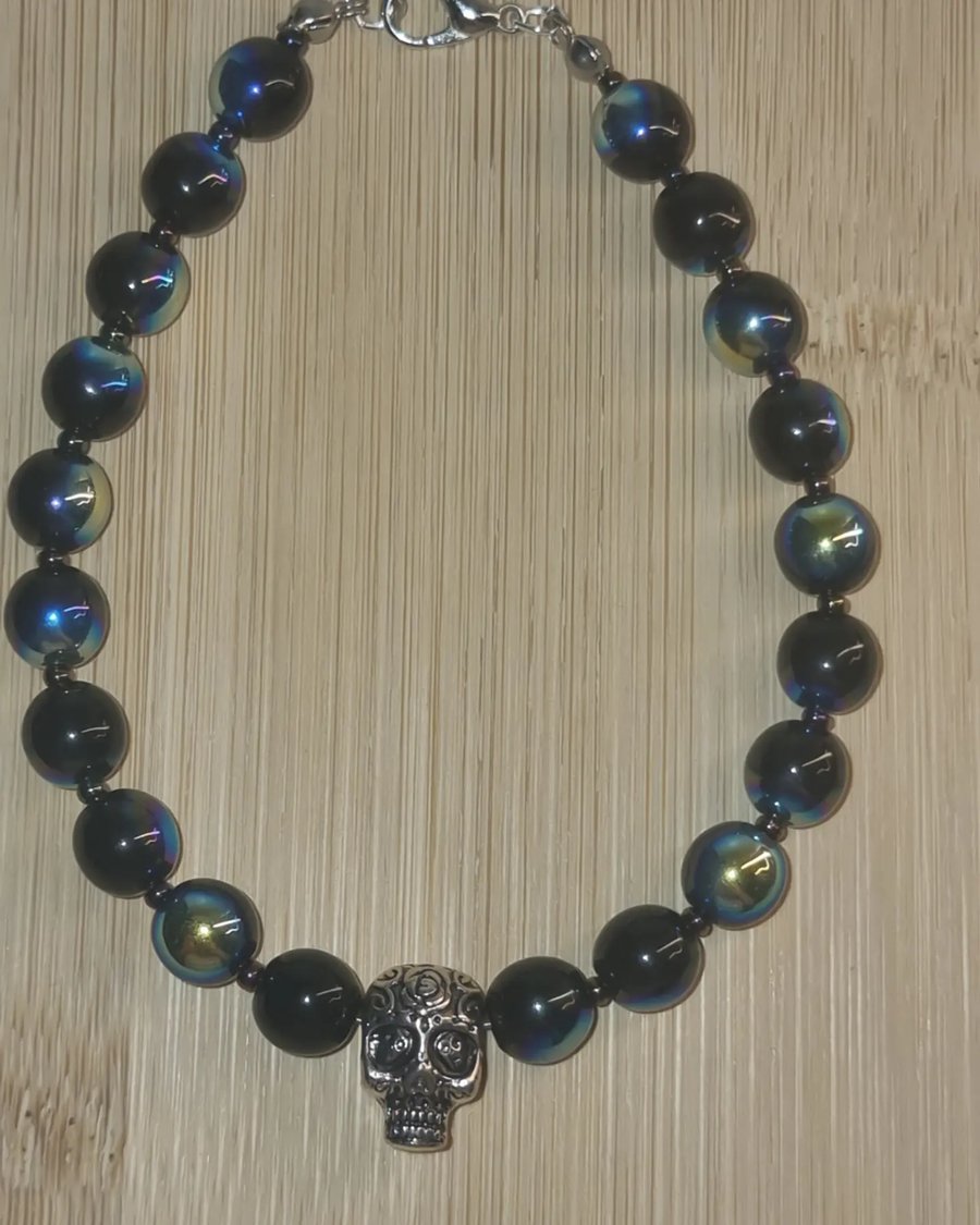 Silver Skull bracelet with metallic black bead