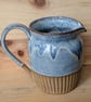 Larger pale blue carved jug (shoulder) - Image 2