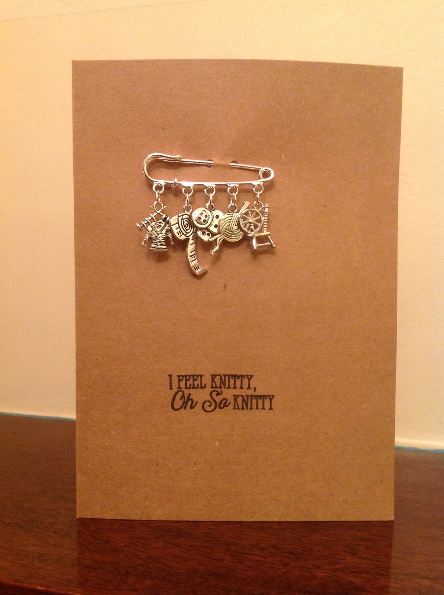 A6 kraft card with a detachable kilt-pin brooch