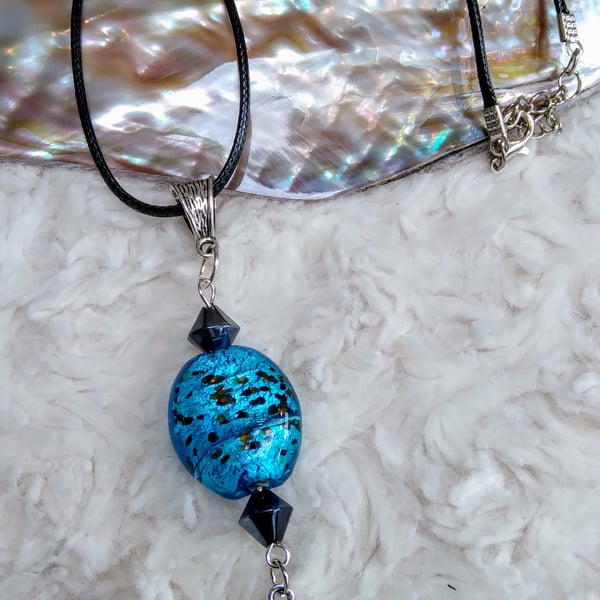 Blue silver foiled LAMPWORK glass with black Swarovski beads on leather NECKLACE